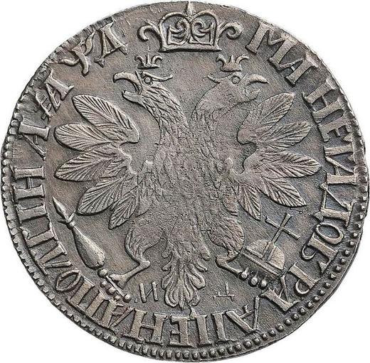 Reverso Poltina (1/2 rublo) ҂АΨД (1704) МД "Retrato del trabajo de F. Alexeev" - valor de la moneda de plata - Rusia, Pedro I