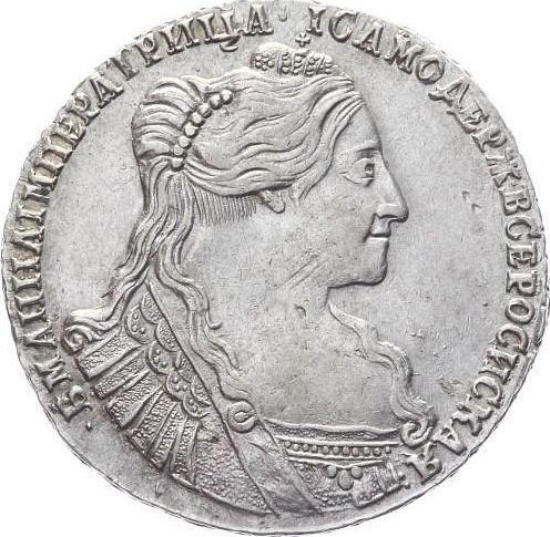 Anverso Poltina (1/2 rublo) 1734 "Tipo 1735" Con medallón en el pecho Cruz del orbe contiene un patrón - valor de la moneda de plata - Rusia, Anna Ioánnovna